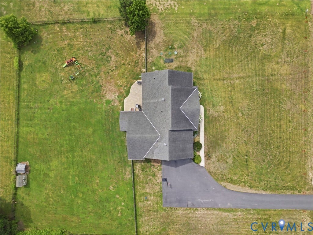 5305 Wellington Ridge Road, Richmond, VA 23231 Expansive property featuring a multi-gabled roofline, a paved driveway, and a stone patio