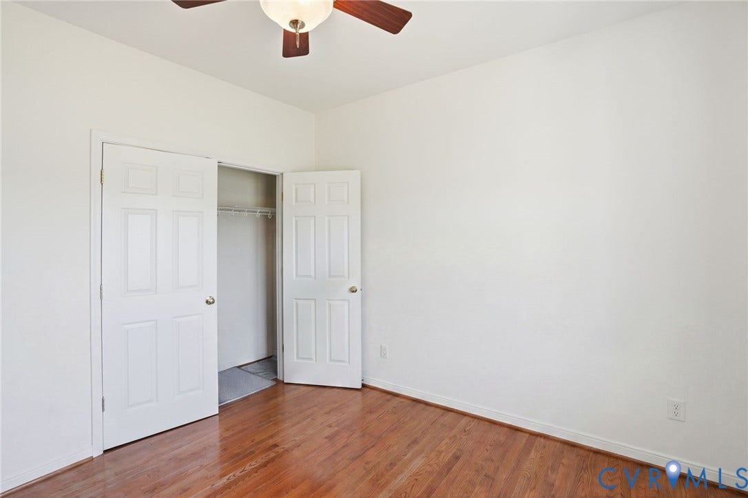 5305 Wellington Ridge Road, Richmond, VA 23231 Room featuring wood-finish flooring, white walls, and a ceiling fan with integrated lighting