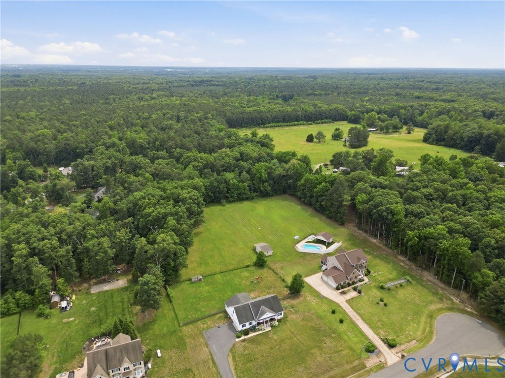 5305 Wellington Ridge Road, Richmond, VA 23231 Aerial perspective showcasing multiple properties situated within a verdant, wooded landscape