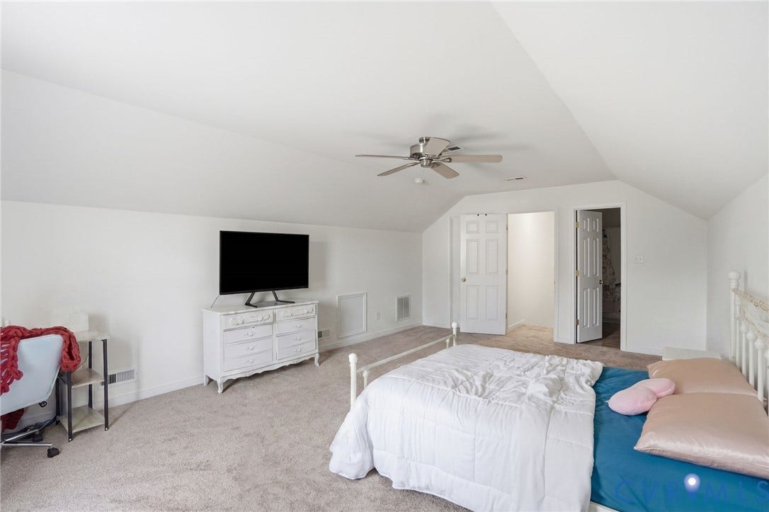 5305 Wellington Ridge Road, Richmond, VA 23231 Carpeted room featuring a sloped ceiling, ceiling fan, and white painted walls