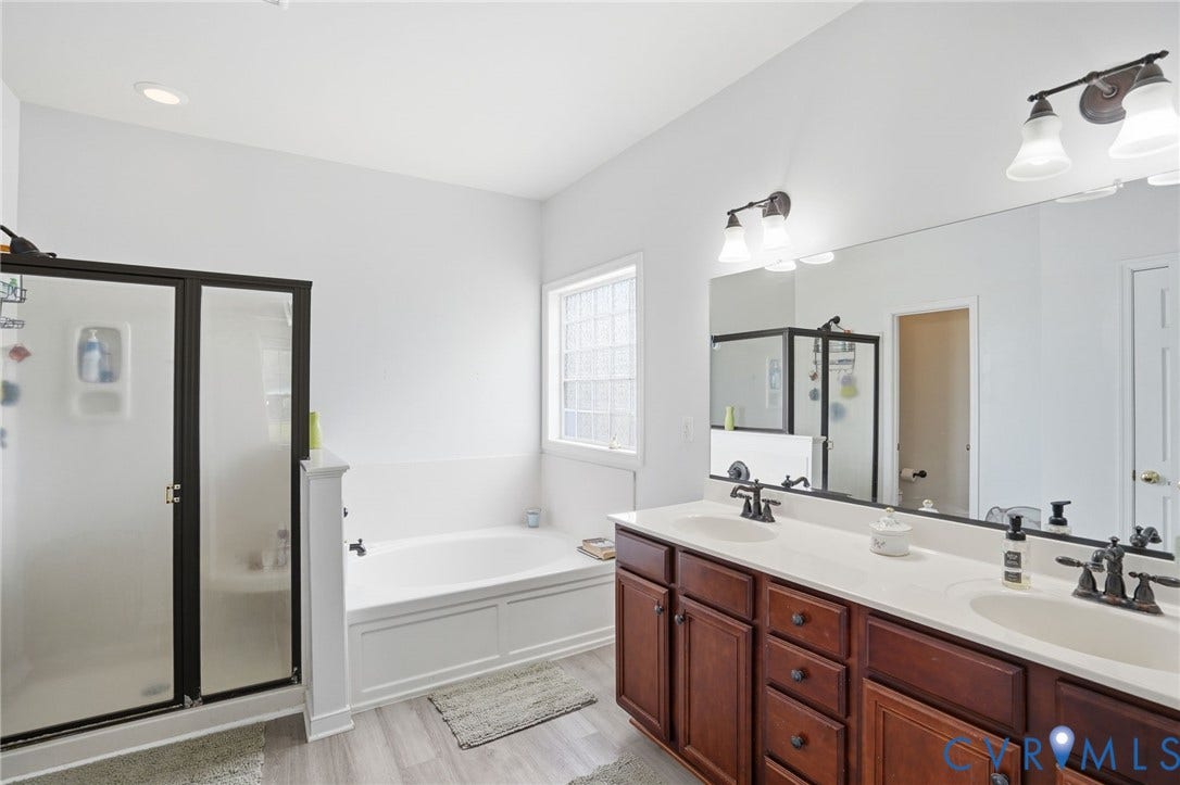 5305 Wellington Ridge Road, Richmond, VA 23231 Bathroom featuring a dual vanity with dark wood-finish cabinetry, white countertop, and dual sinks