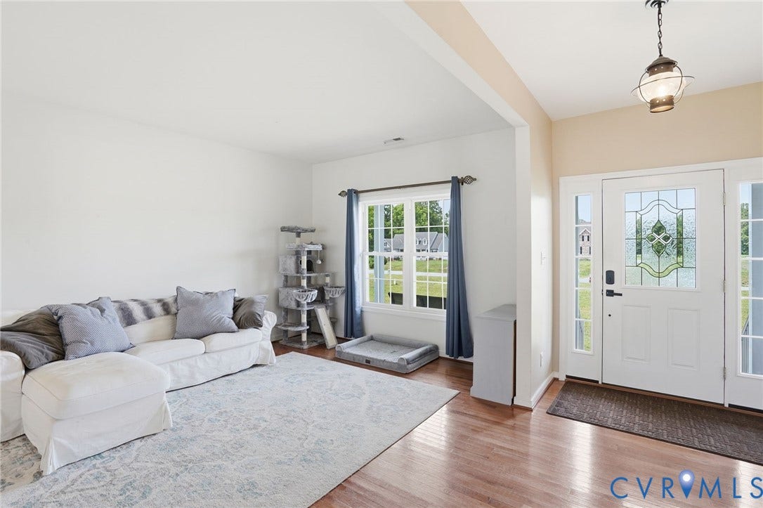 5305 Wellington Ridge Road, Richmond, VA 23231 Entryway featuring a decorative glass front door, side panel windows, and a hanging lantern light fixture