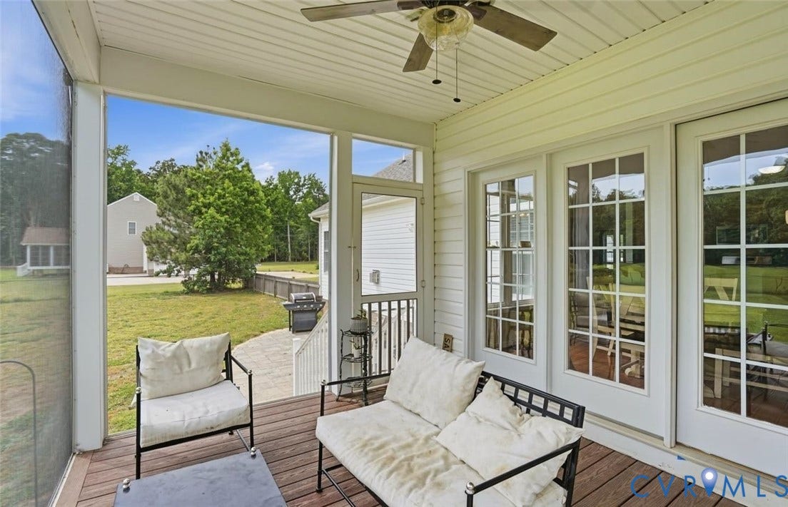5305 Wellington Ridge Road, Richmond, VA 23231 Screened porch featuring wood-finish decking, a ceiling fan, and white siding