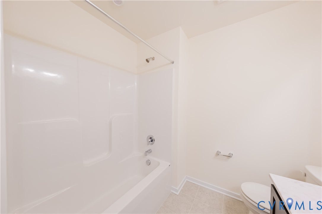 18372 Palisades Court, Chesterfield, VA 23120 White fiberglass tub and shower combination with chrome fixtures