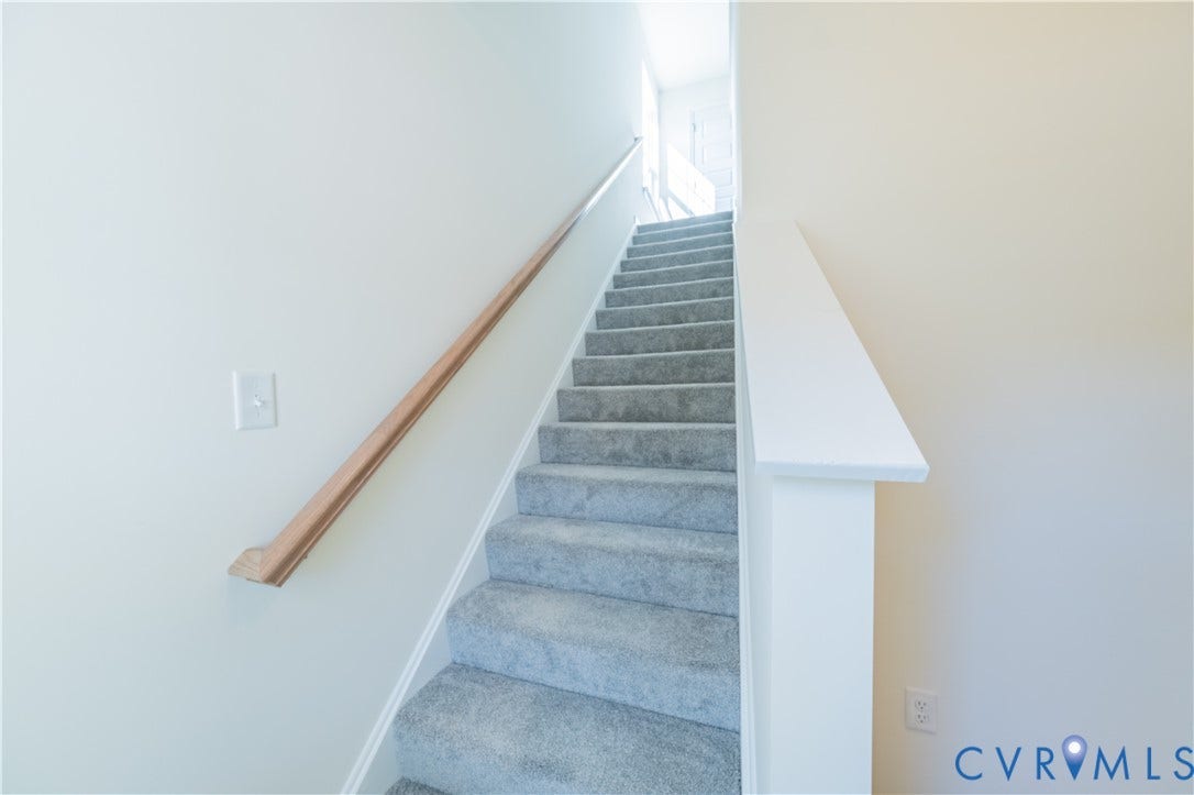 18372 Palisades Court, Chesterfield, VA 23120 Carpeted staircase featuring a light wood-finish handrail and crisp white walls