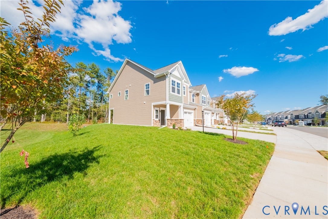18372 Palisades Court, Chesterfield, VA 23120 Contemporary residential exterior featuring siding and stone accents, a single-car garage, and a covered entry