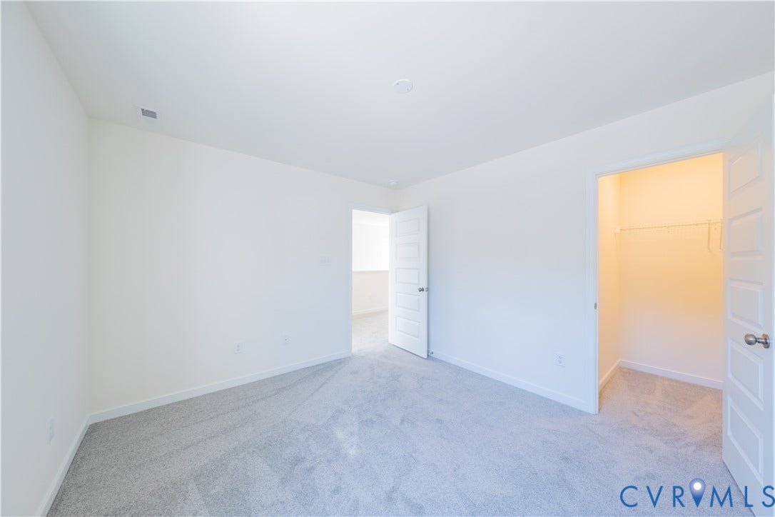 18372 Palisades Court, Chesterfield, VA 23120 Spacious room featuring light gray carpeting, white walls, a single-panel interior door, and a closet with a wire shelving system
