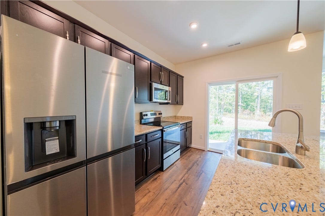 18372 Palisades Court, Chesterfield, VA 23120 Kitchen featuring stainless steel appliances, granite countertops, and dark wood-finish cabinetry