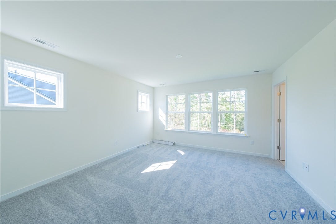 18372 Palisades Court, Chesterfield, VA 23120 Expansive room with neutral carpeting and white baseboards