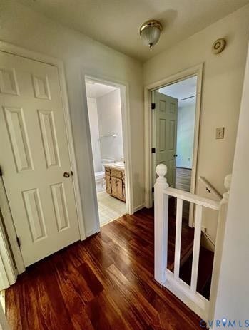 Wood-finish flooring throughout the hallway