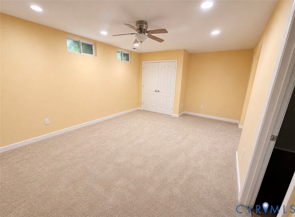 3118 Perdue Springs Lane, Chester, VA 23831 Neutral-toned carpeting, recessed lighting, ceiling fan, and white bi-fold closet doors