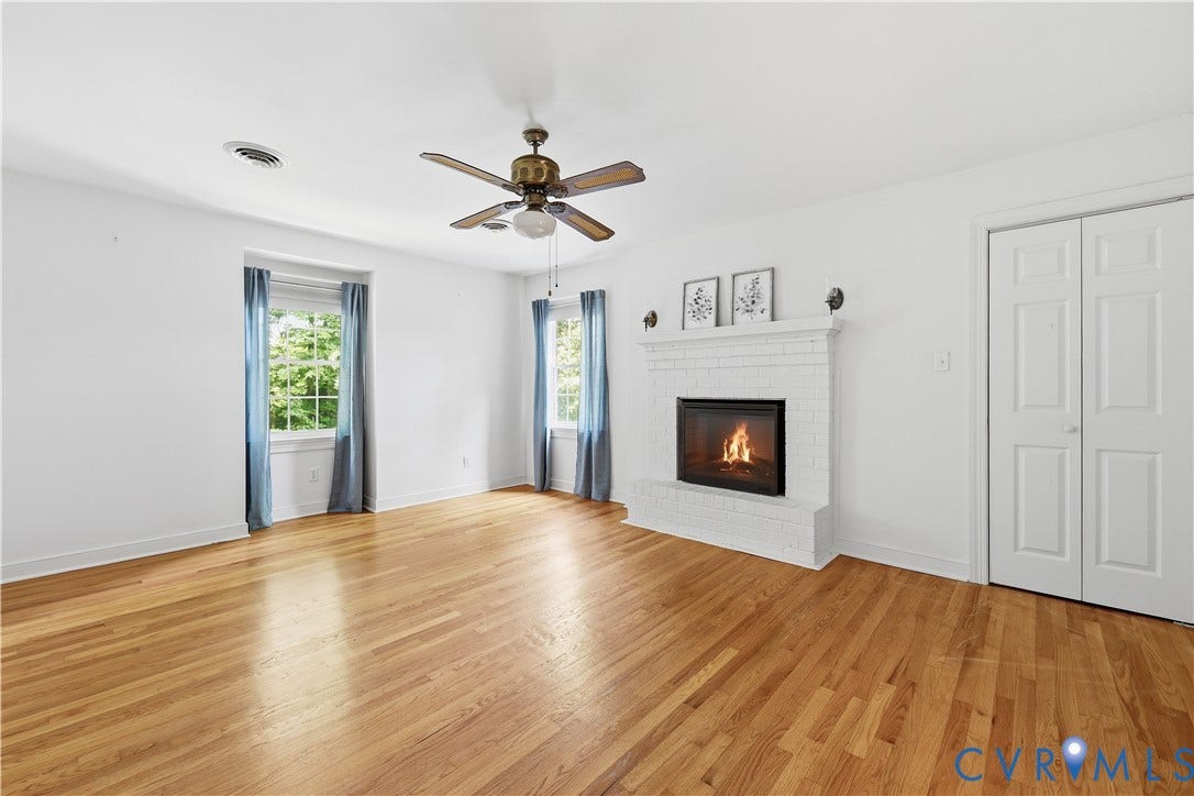 1610 Reams Road, Powhatan, VA 23139 Primary Bedroom showing, Gas fireplace, ensuite and walk in closet.
