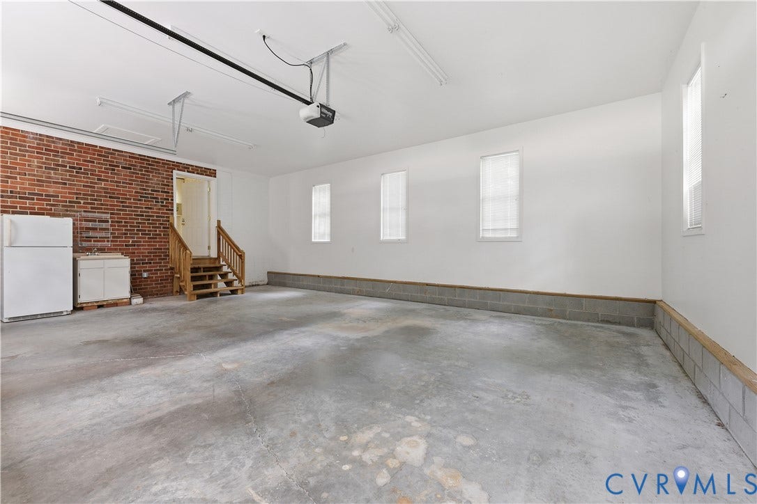 1610 Reams Road, Powhatan, VA 23139 Attached Garage with wash sink and refrigerator.