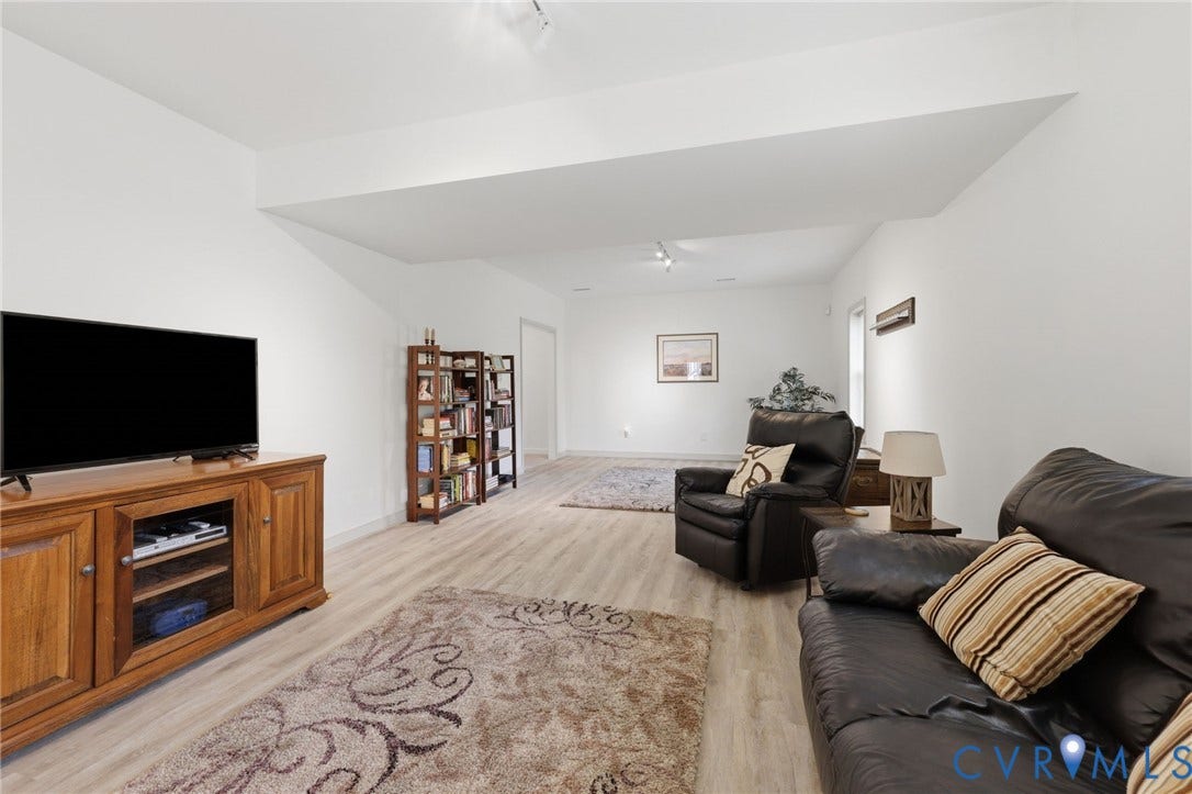 4320 Stebbins Street, Chester, VA 23831 28x13- this room is huge! Opens to walk out, covered rock patio