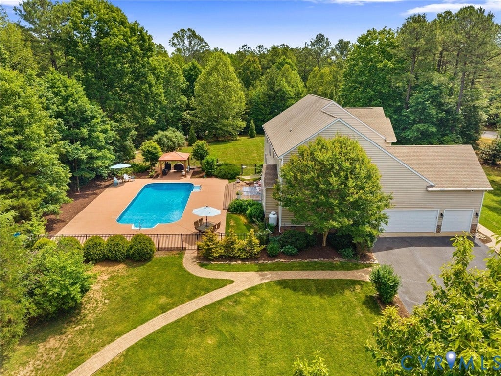 Private, 3.10 acre lot, in a neighborhood, AND the kids can walk to school!