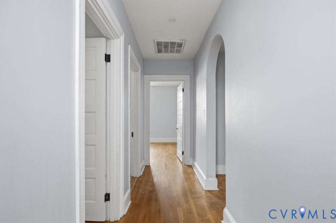 125 Richmond Avenue, Colonial Heights, VA 23834 Hallway with wood-finish flooring, light gray walls, and white trim