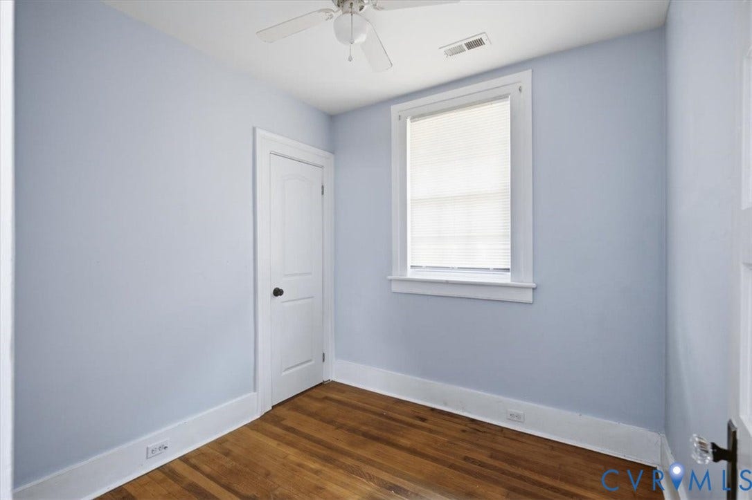 125 Richmond Avenue, Colonial Heights, VA 23834 Room featuring wood-finish flooring, light blue walls, and white trim