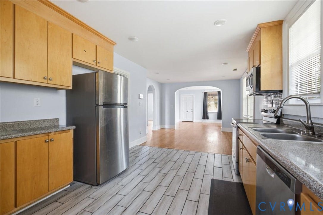 125 Richmond Avenue, Colonial Heights, VA 23834 Kitchen featuring light wood cabinetry, stone-finish countertops, stainless steel appliances, and plank-style tile flooring