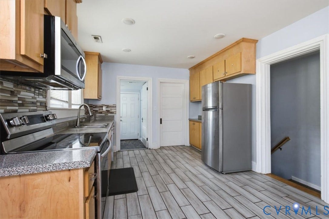125 Richmond Avenue, Colonial Heights, VA 23834 Kitchen featuring wood cabinetry, stainless steel appliances, speckled countertops, and a mosaic tile backsplash