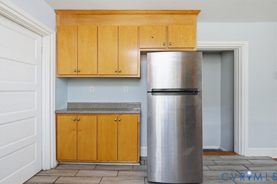 125 Richmond Avenue, Colonial Heights, VA 23834 Kitchen area featuring light wood-finish cabinetry, a stone-finish countertop, and a stainless steel refrigerator