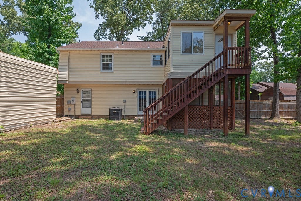 Rear exterior featuring a two-story design with light-colored siding