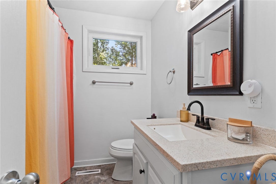 2448 Mountain View Road, Powhatan, VA 23139 Bathroom features an updated vanity and vinyl tile floors