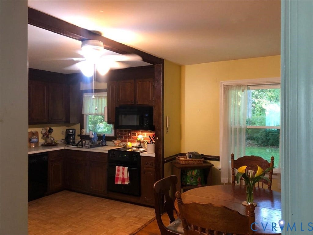 10001 Alfaree Road, Kendale Acres Addition, Chester, VA 23237 Kitchen featuring wood cabinetry, white countertops, built-in black appliances, and a ceiling fan