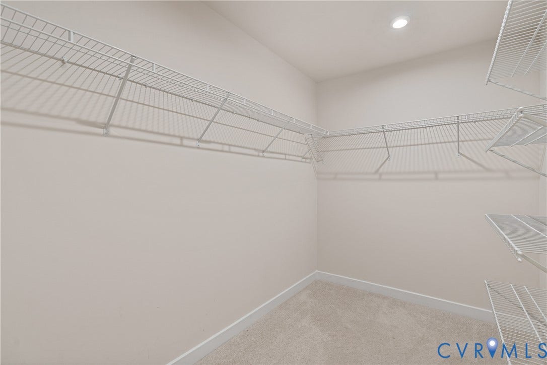 7213 Lyon Taylor Lane, Summer Maple, New Kent, VA 23124 Walk-in closet featuring wire shelving, recessed lighting, neutral wall paint, and carpeting