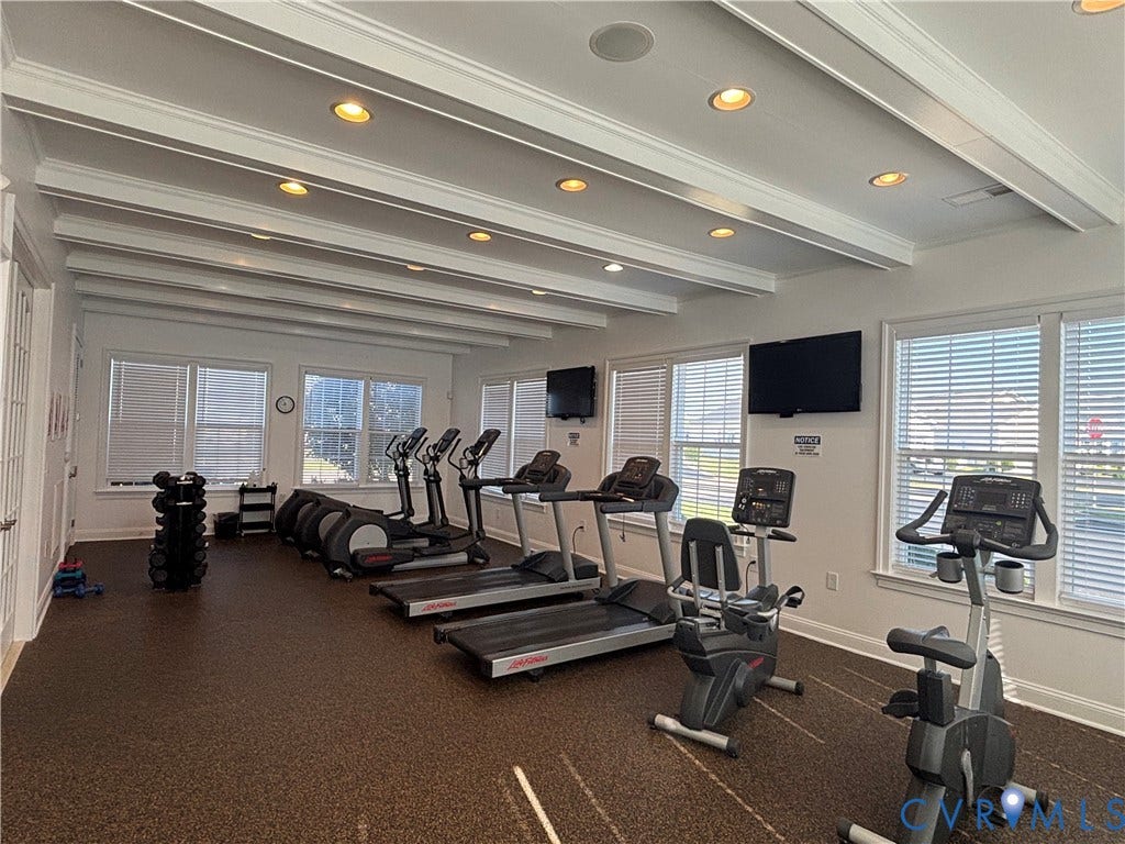 7213 Lyon Taylor Lane, Summer Maple, New Kent, VA 23124 Spacious fitness area featuring rubberized flooring, multiple windows with blinds, recessed lighting, and decorative ceiling beams
