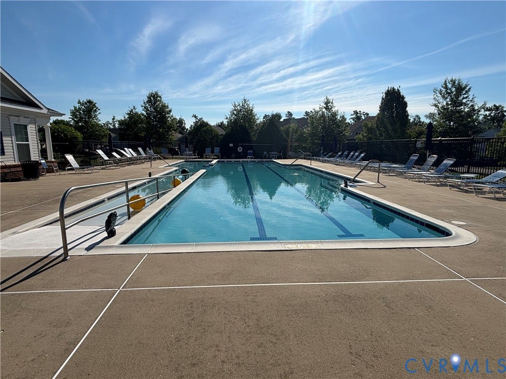 7213 Lyon Taylor Lane, Summer Maple, New Kent, VA 23124 Rectangular swimming pool with lane markers, surrounded by a concrete deck
