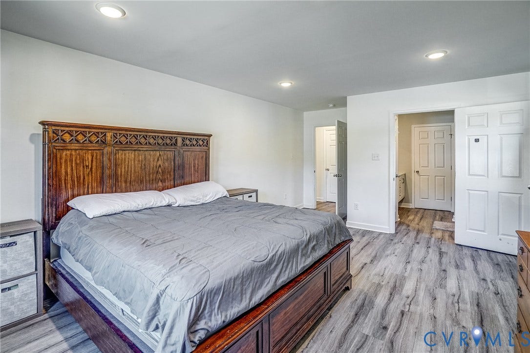 65 Hopeful Church Lane, Bumpass, VA 23024 Living room featuring wood-finish flooring and recessed lighting