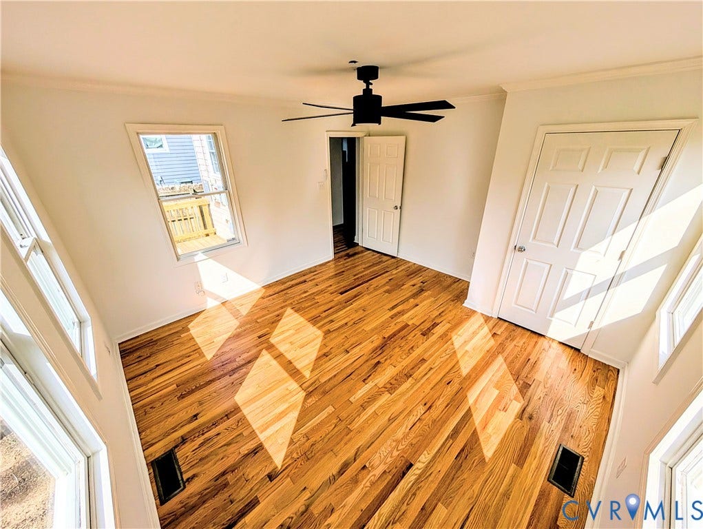 3216 Enslow Avenue, Richmond, VA 23222 Room featuring wood-finish flooring, white walls, and a black ceiling fan