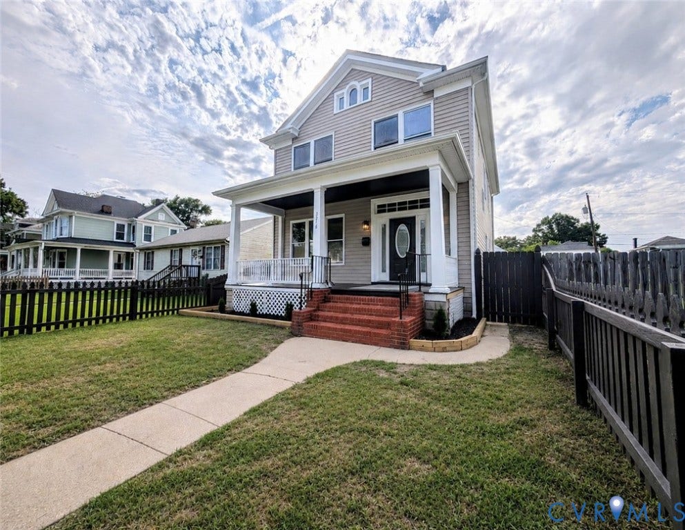 3216 Enslow Avenue, Richmond, VA 23222 Two-story residence featuring light gray siding, white trim, and a covered front porch with white columns