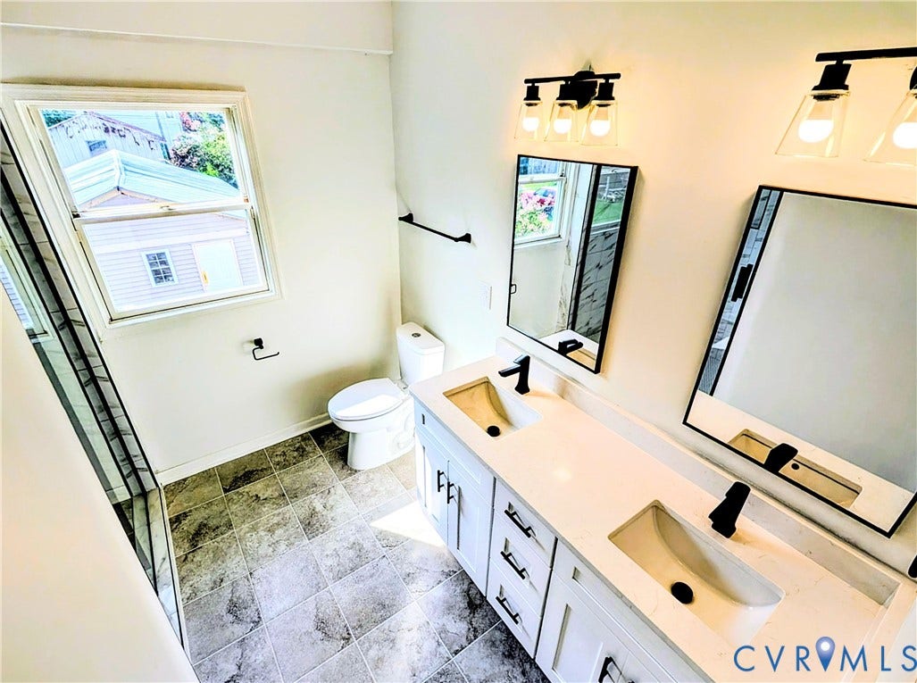 3216 Enslow Avenue, Richmond, VA 23222 Bathroom featuring a dual vanity with integrated sinks, white countertops, and matte black fixtures