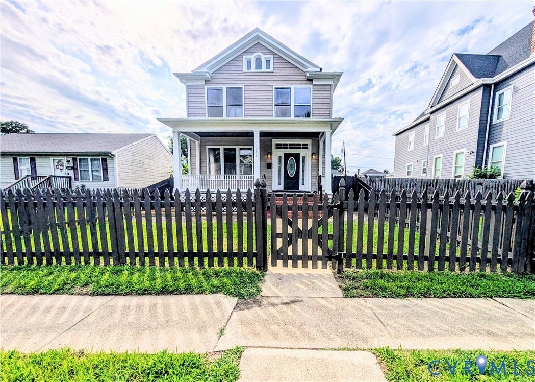 3216 Enslow Avenue, Richmond, VA 23222 Traditional two-story residence featuring siding exterior, a welcoming covered front porch, and a peaked roofline
