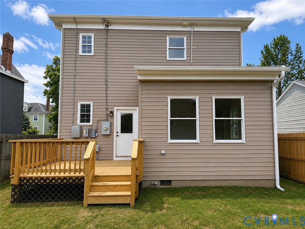3216 Enslow Avenue, Richmond, VA 23222 Rear exterior featuring tan horizontal siding and white trim