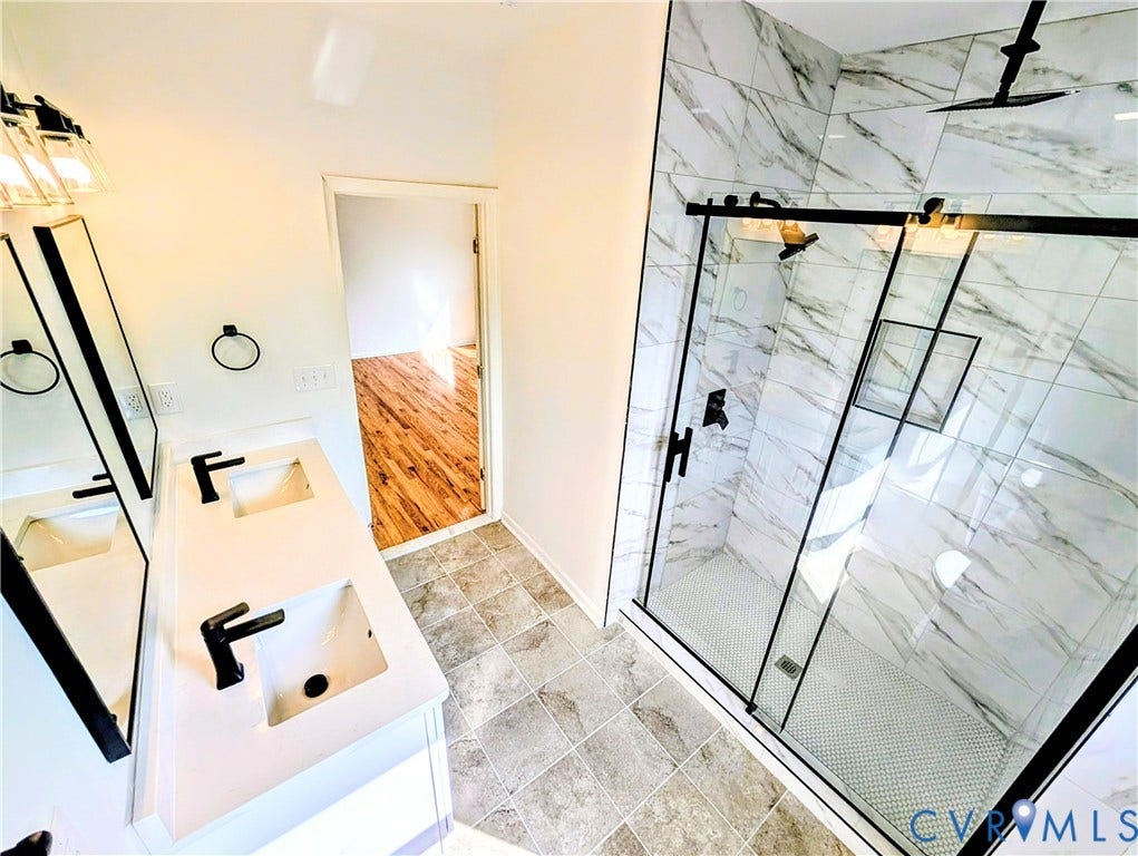 3216 Enslow Avenue, Richmond, VA 23222 Primary bathroom featuring a dual vanity with rectangular sinks and matte black faucets