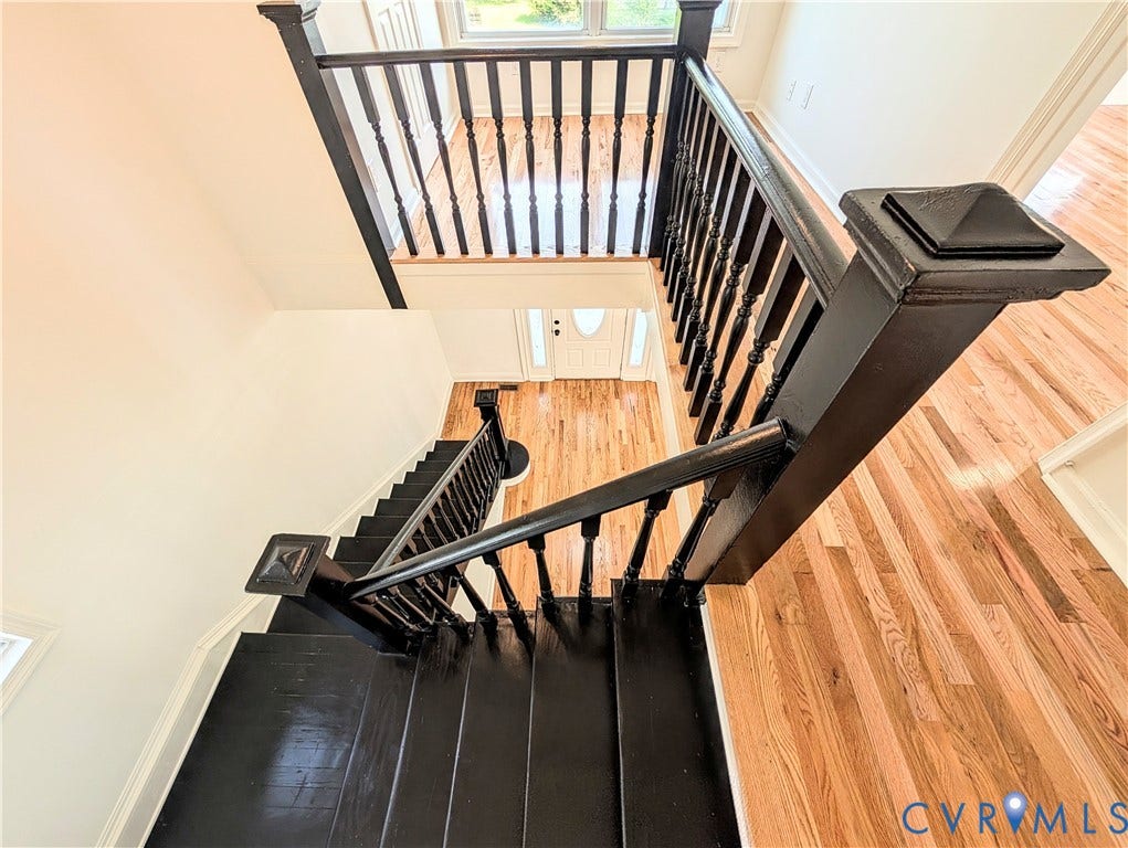 3216 Enslow Avenue, Richmond, VA 23222 Two-story entryway featuring a grand staircase with painted black treads and balusters