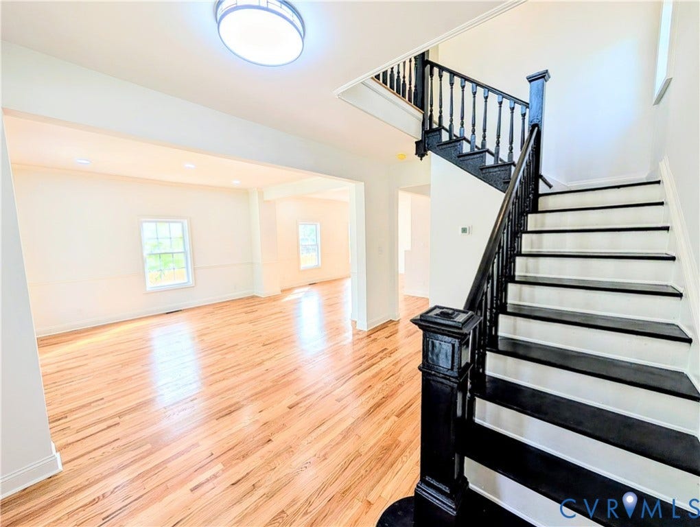 3216 Enslow Avenue, Richmond, VA 23222 Grand entry featuring a dark-stained wood staircase with white risers and balusters