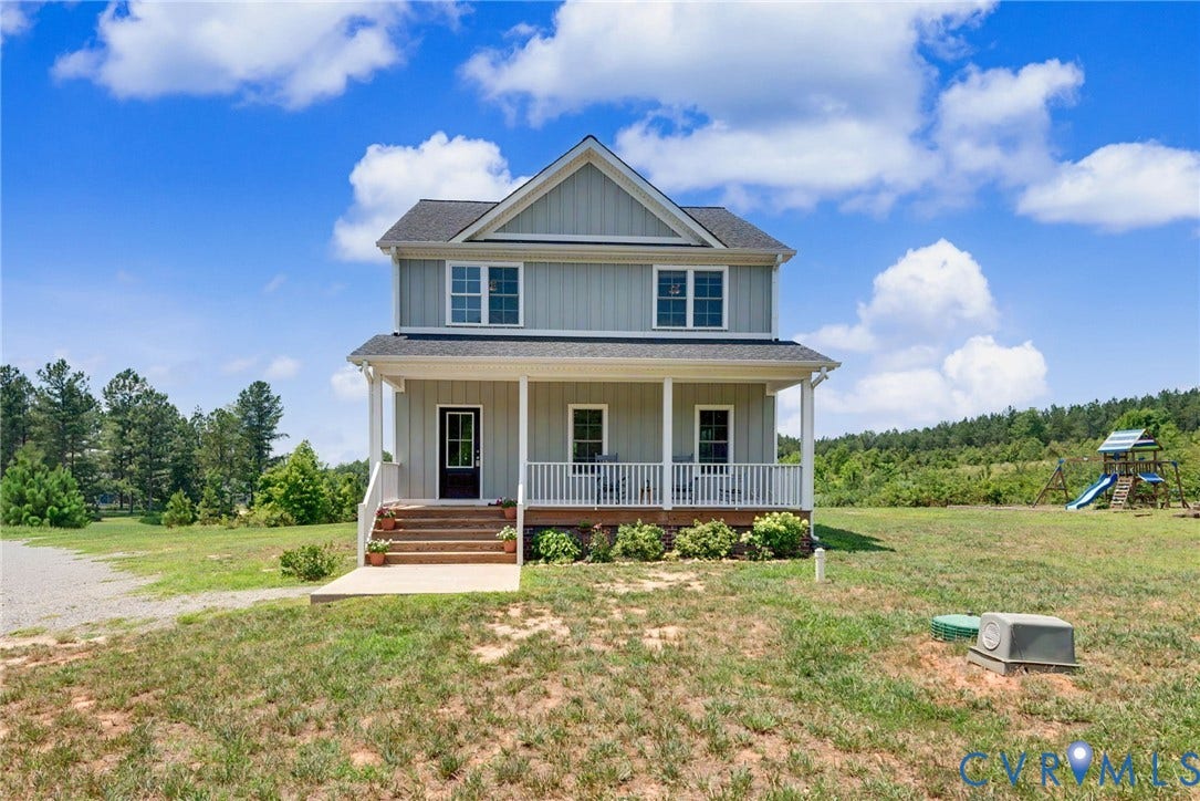 815 Kennon Road, Northeast Creek Reservoir Subd, Mineral, VA 23117 Two-story residence featuring light gray siding with white trim and a covered front porch