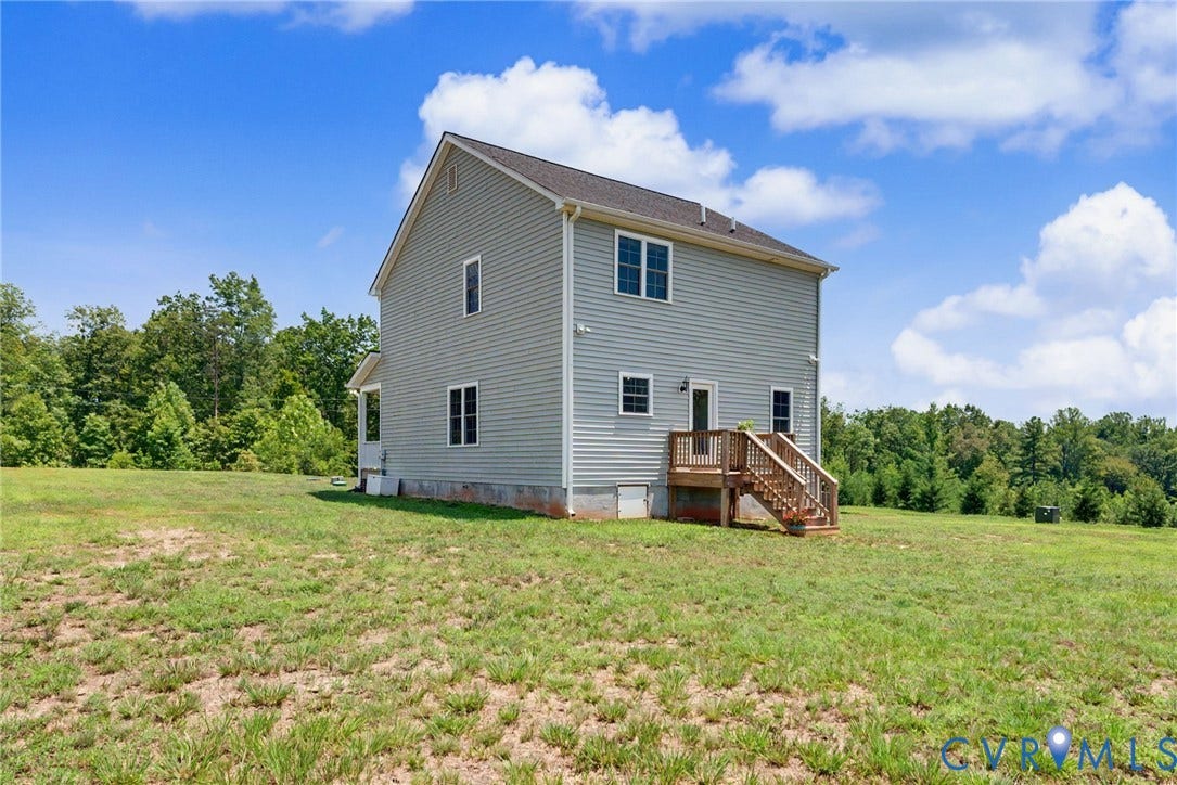 815 Kennon Road, Northeast Creek Reservoir Subd, Mineral, VA 23117 Two-story residence featuring light gray siding, a dark shingle roof, and multiple windows