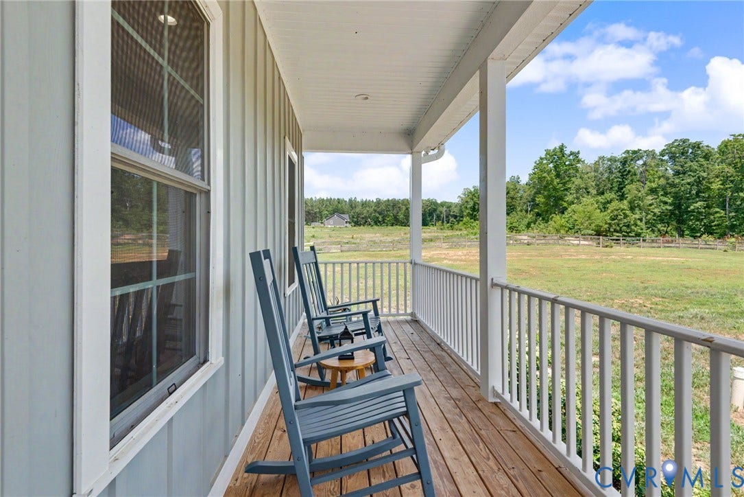 815 Kennon Road, Northeast Creek Reservoir Subd, Mineral, VA 23117 Inviting covered porch with a wood-finish floor and white balustrade
