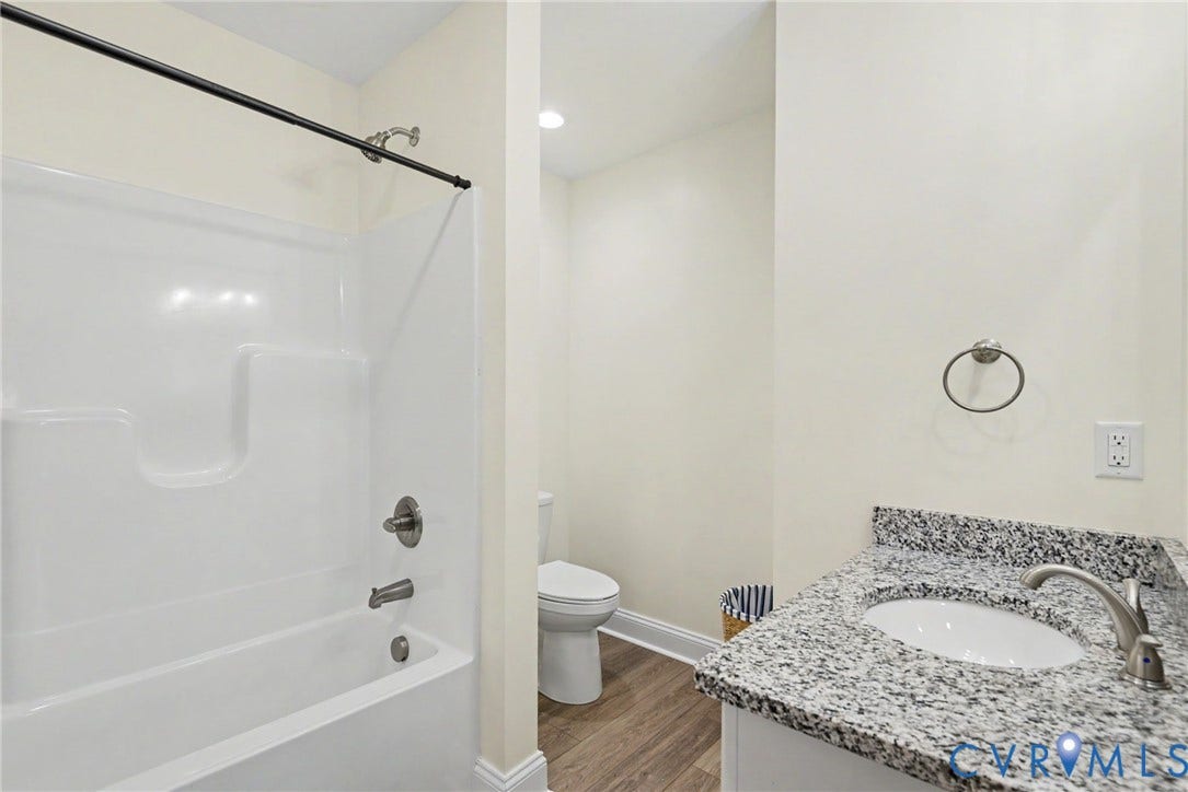815 Kennon Road, Northeast Creek Reservoir Subd, Mineral, VA 23117 Full bathroom featuring a white tub and shower combination with brushed nickel fixtures