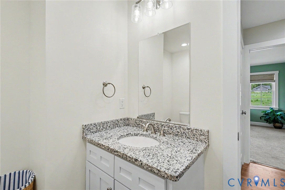 815 Kennon Road, Northeast Creek Reservoir Subd, Mineral, VA 23117 Vanity featuring a granite countertop, undermount sink, and brushed nickel faucet