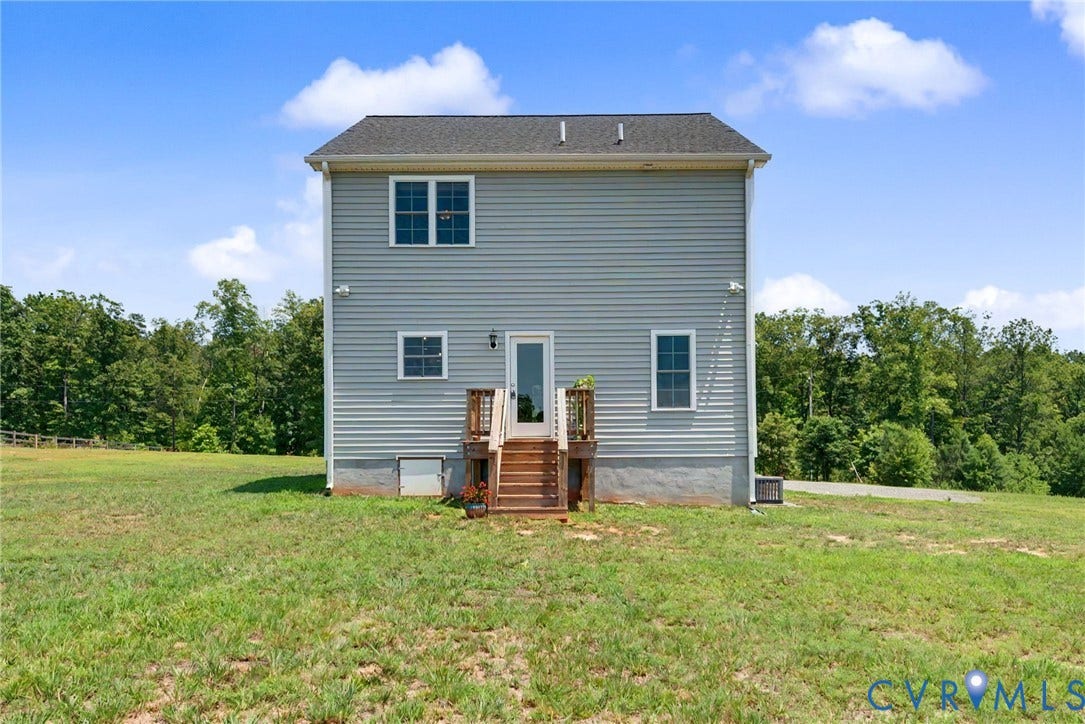 815 Kennon Road, Northeast Creek Reservoir Subd, Mineral, VA 23117 Two-story residence featuring gray siding, a dark shingle roof, and multiple windows