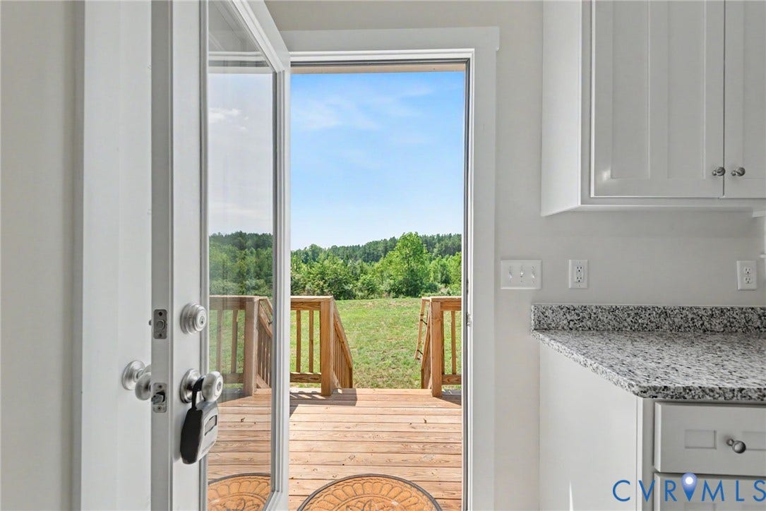 815 Kennon Road, Northeast Creek Reservoir Subd, Mineral, VA 23117 Glass patio door opening to a wooden deck