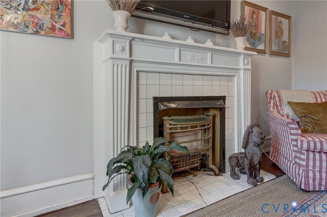 2619 Grayland Avenue, Byrd Park/Upper Fan, Richmond, VA 23220 Ornate fireplace featuring a white mantel, decorative corbels, and fluted detailing