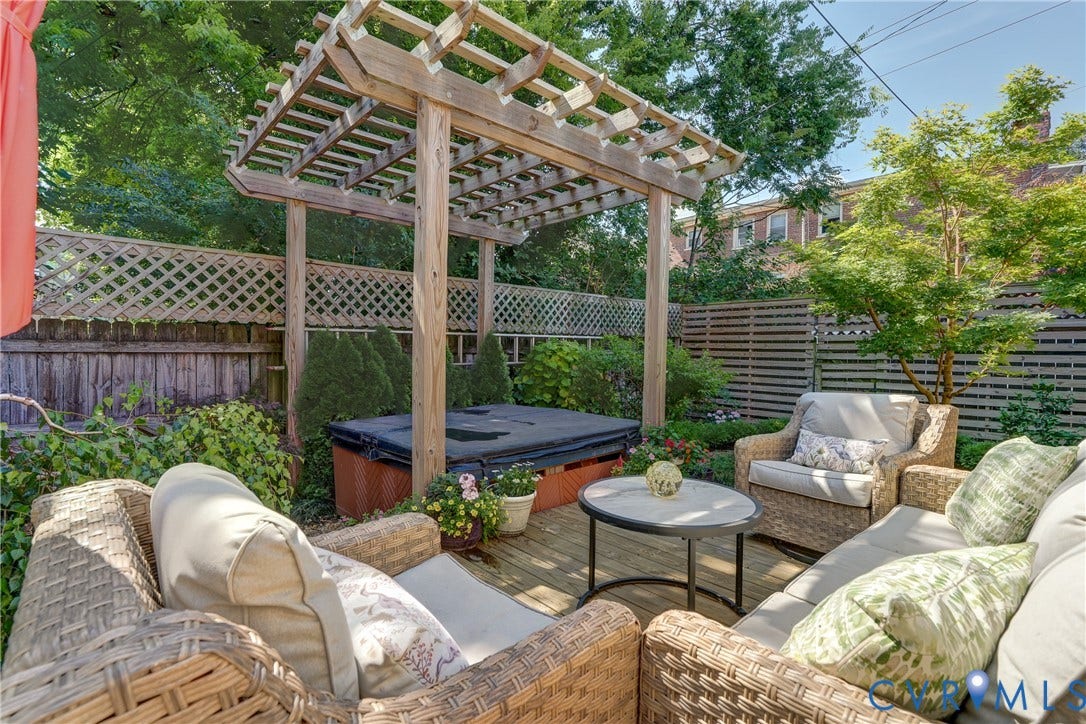 2619 Grayland Avenue, Byrd Park/Upper Fan, Richmond, VA 23220 Wood deck patio featuring a pergola, built-in spa, wood lattice fencing, and surrounding landscaping