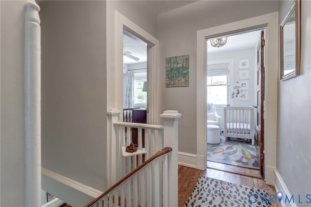 2619 Grayland Avenue, Byrd Park/Upper Fan, Richmond, VA 23220 Hallway featuring hardwood flooring, white painted balusters and newel post