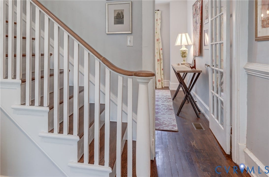 2619 Grayland Avenue, Byrd Park/Upper Fan, Richmond, VA 23220 Hardwood staircase with white risers and balusters, featuring a curved wood handrail